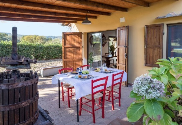 A dining area has been set up in the loggia in front of the main entrance- La Vigna