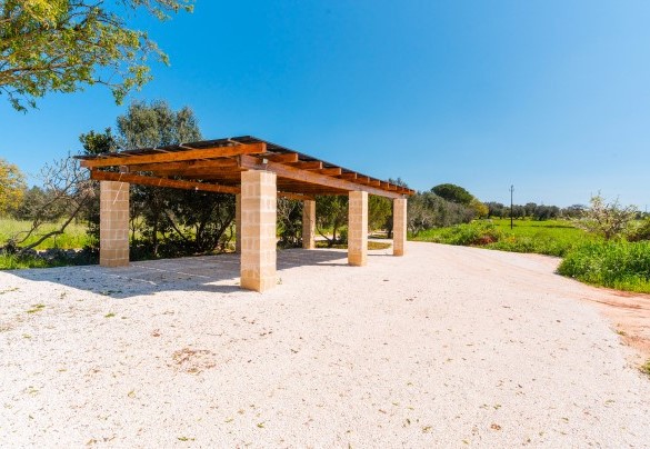 The covered parking area at the entrance to the property - Masseria Grotta Antica