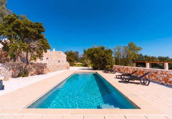 The modern-design swimming pool nestled in the Mediterranean garden - Masseria Grotta Antica