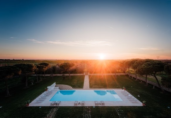 Swimming pool at sunset. Masseria Samali