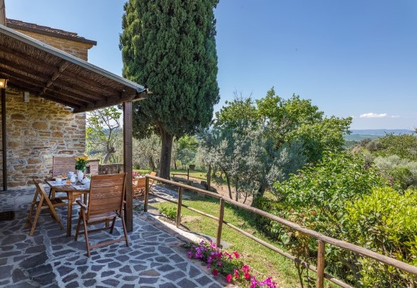  A panoramic portico equipped with table and chairs completes this ideal setting- Monterzi