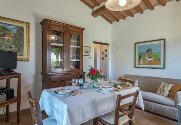 The front door enters the living room with a dining area - Monterzi