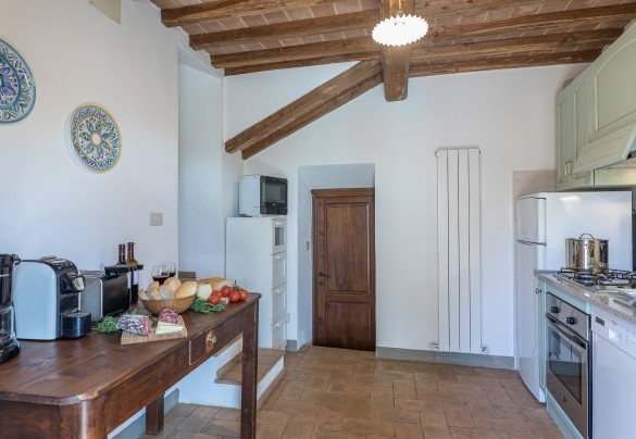A short flight of stairs leads down to the lower floor with laundry and kitchen - Monterzi