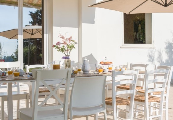 Outdoor dining area, shaded by awning - Nonna Isa
