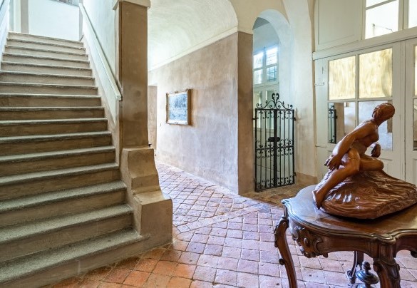 The entrance hall and the staircase leading to the upper floor - Palazzo Pozzobonelli