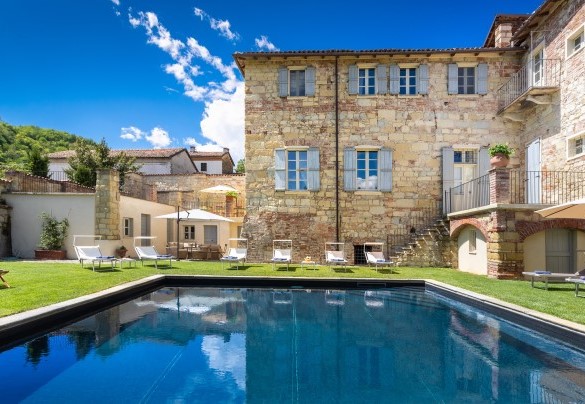 The vain palace is reflected in the clear water of the pool - Palazzo Pozzobonelli