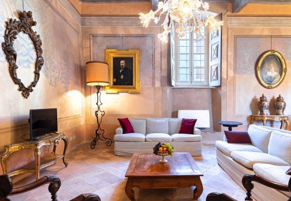 Living, sofas and TV with antique furnishing
