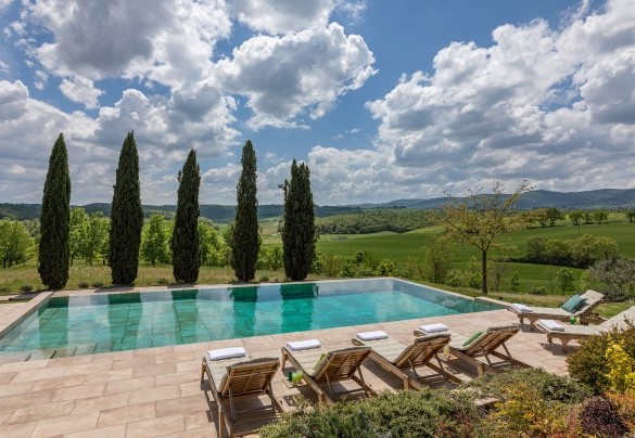 The swimming pool with majestic cypress trees in front - Podere Fabbrica
