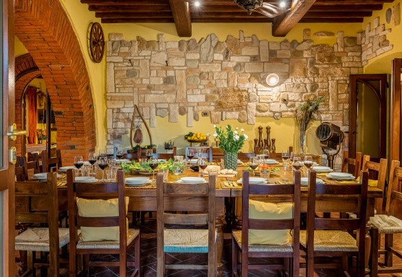 The large open-plan area with double kitchen on ground floor of the main building - Podere Giardino