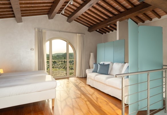 The loft on the first floor in the annex with two single beds – Podere Terranuova