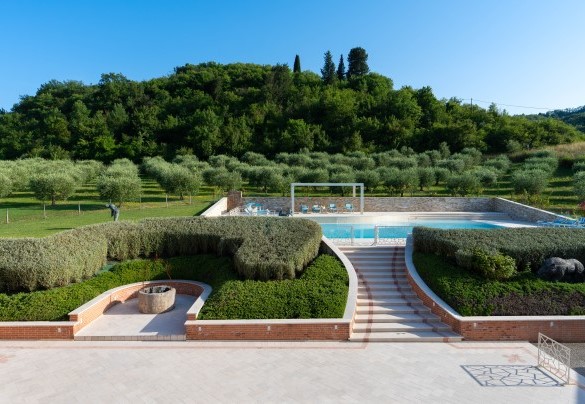 The pool area is located in front of the main house and can be reached up the marble stairs – Podere Terranuova