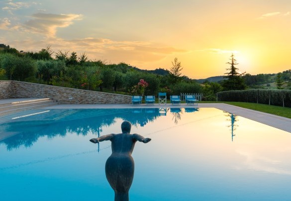 The olive trees naturally embrace the pool, providing a sense of intimacy – Podere Terranuova