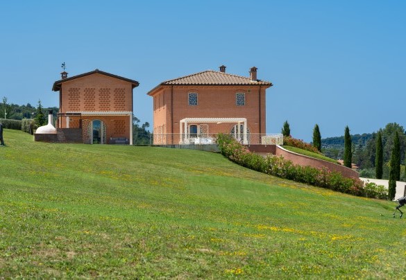 The house looks like a typical country farmhouse with a barn, but completely renovated – Podere Terranuova