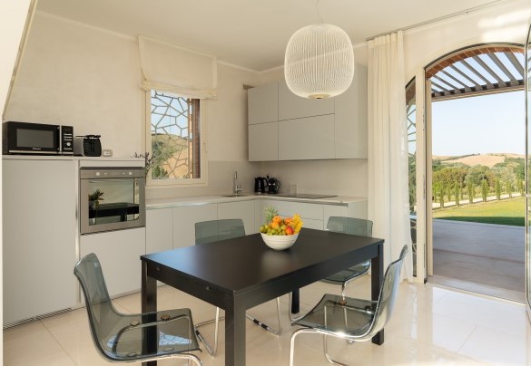 The kitchenette on the ground floor in the annex with French door which leads on the terrace – Podere Terranuova