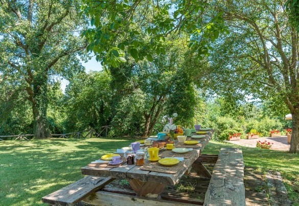 The characteristic wooden table in the garden - San Francesco