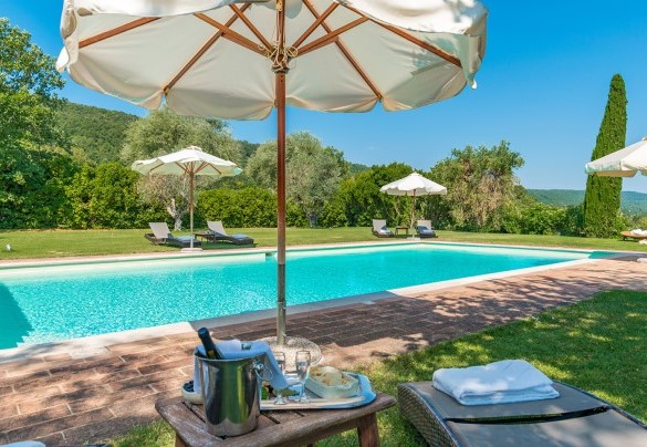 The pool area full of umbrellas - San Francesco