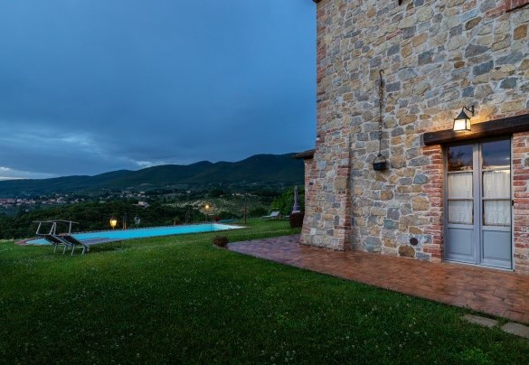 The property lit up at dusk - San Rocco