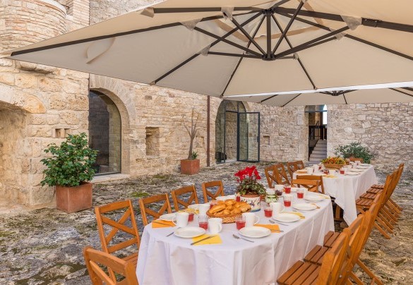 The tables prepared for eating outdoors all together - Santa Illuminata