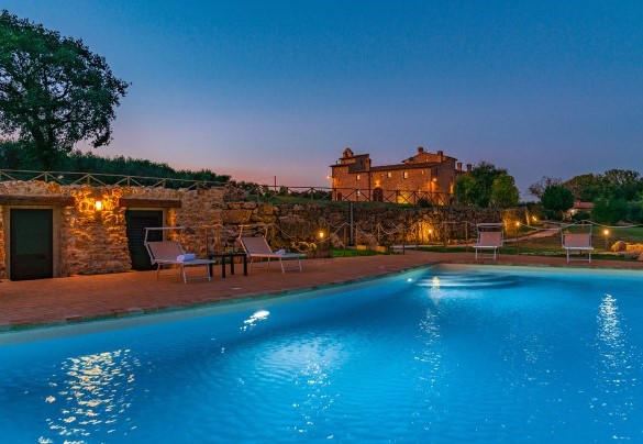 The swimming pool and the Monastery illuminated at sunset - Santa Illuminata
