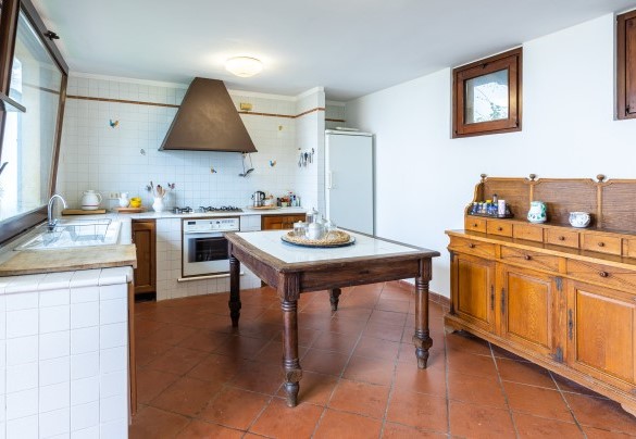 The kitchen on the ground floor communicates with the dining room  - Tenuta Contessa Chiara