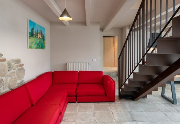 The living room with the corten steel stair case – Terrazza sulla valle