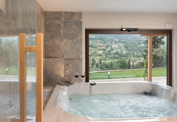 Panoramic view over the Arezzo hills through the window in the relaxing area – Terrazza sulla valle