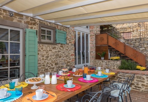 The main kitchen’s porch is equipped for alfresco breakfasts - Torre Ginestre