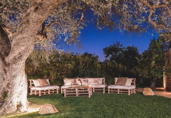 The relaxation area to the west with raw table seating -Trulli Biancapetra
