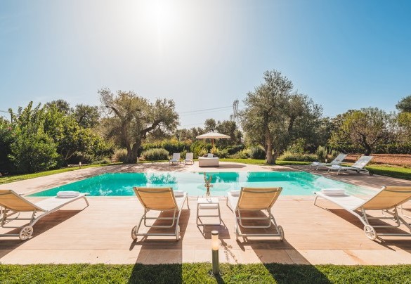 The rectangular-shaped swimming pool is 40 square meters wide and faces south -Trulli Biancapetra