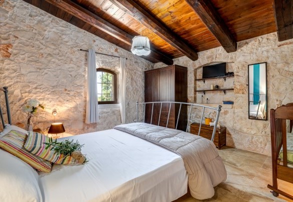 The first double room has a large cot inside – Trulli Littoria