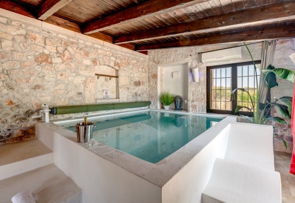 Diving into the stone jacuzzi you can contemplate the view outside  – Trulli Littoria 
