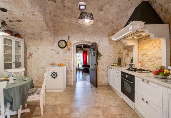 The characteristic stone kitchen leads directly into the spa area  – Trulli Littoria