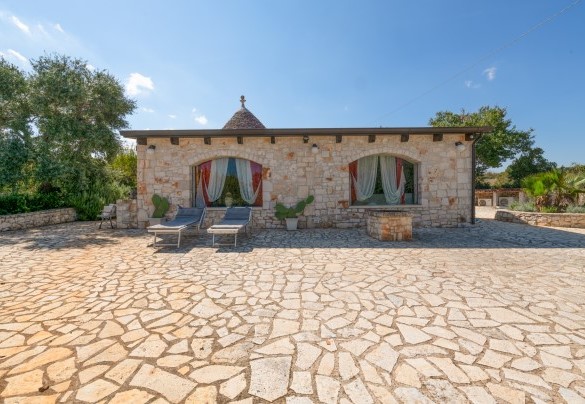 The spacious outdoor solarium area adjacent to the indoor spa  – Trulli Littoria