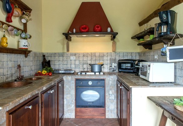 The built-in kitchen open with the dining room - Val di Marco