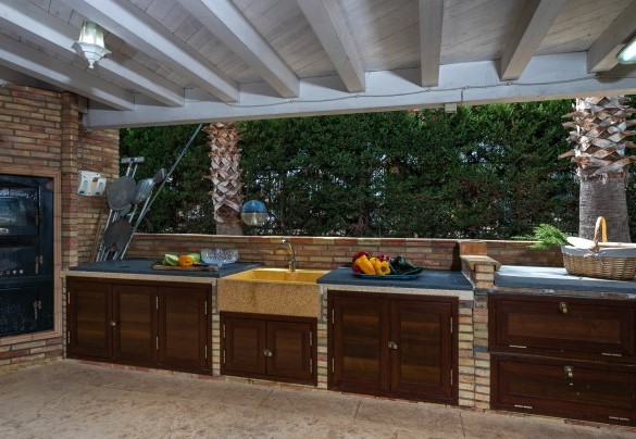 The open-air kitchen under the pergola  - Villa Alessia
