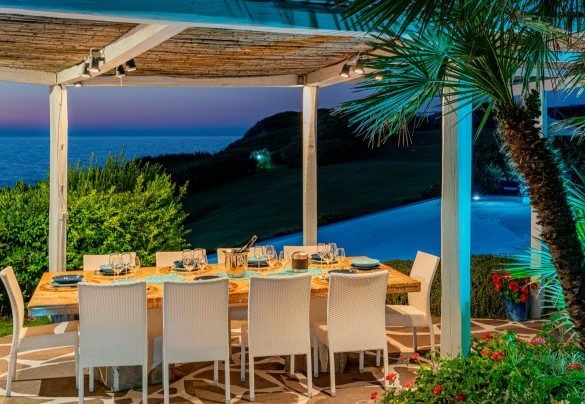 Outdoor living area at sunset – Villa Ambra