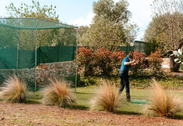 Golf training net set within the garden grounds - Villa Belkis
