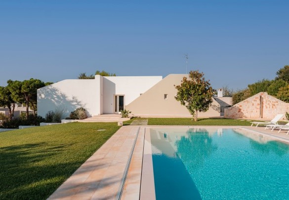 The swimming pool is located within the grounds of the property - Villa Bellina
