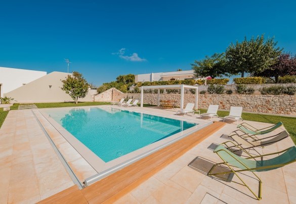 The green lawn caresses the entire east side of the property - Villa Bellina