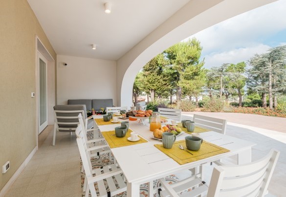 The table set up for breakfasts under the panoramic veranda -Villa Bellina