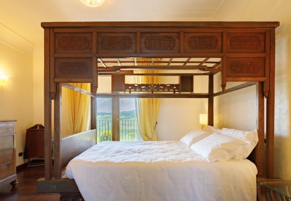 A canopy double bed adorns the master bedroom - Villa California