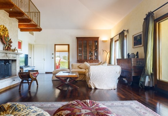 The living room features a comfortable sofa, where you can enjoy TV - Villa California