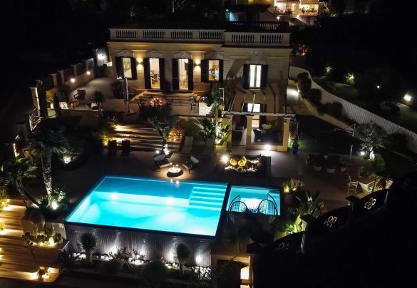 Evocative bird’s eye view of the villa in the evening lights – Villa Callari