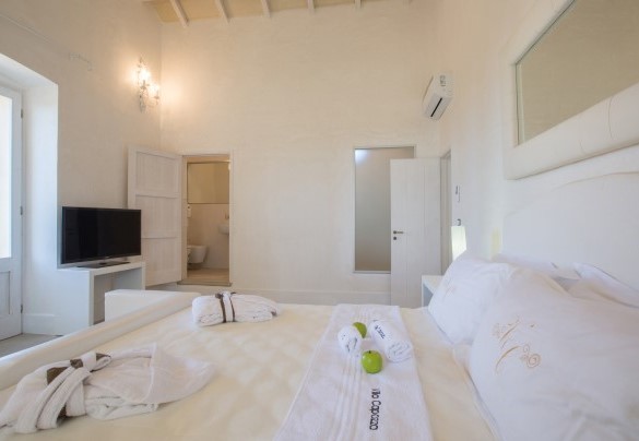 Suite Lavanda al primo piano della depandance, dotata di bagno en suite con doccia. Villa Capozza 