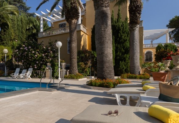The wonderful Mediterranean-inspired garden, overlooking the sea, with the large swimming pool and prestigious villa – Villa Carina