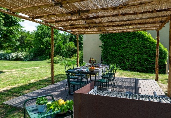 The gazebo features a table, chairs, and barbecue for outdoor dining - Villa Collegigliato
