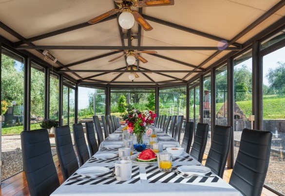 Gazebo with glass doors and ceiling fans for outdoor dining – Villa Croci 
