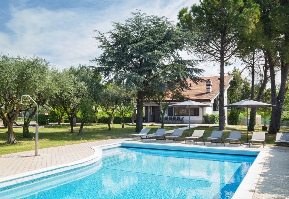 The pool is only a few steps away from the Villa and surrounded by the big private garden - Villa delle Coste
