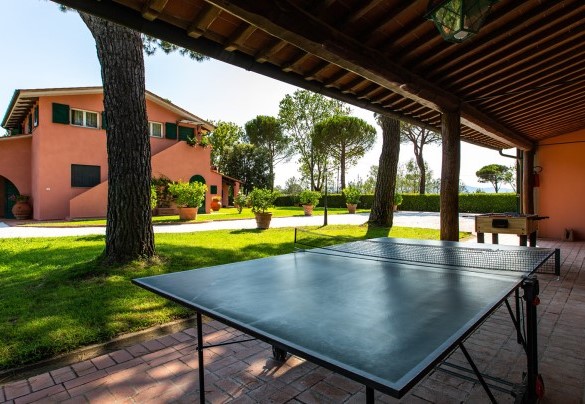 The ping pong table in the shadow of the large portico – Villa Elisa 