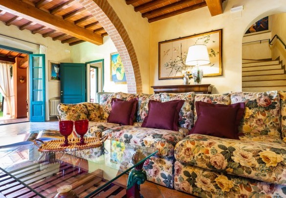 Seating space with fireplace not in use and sat Tv – Villa Elisa 